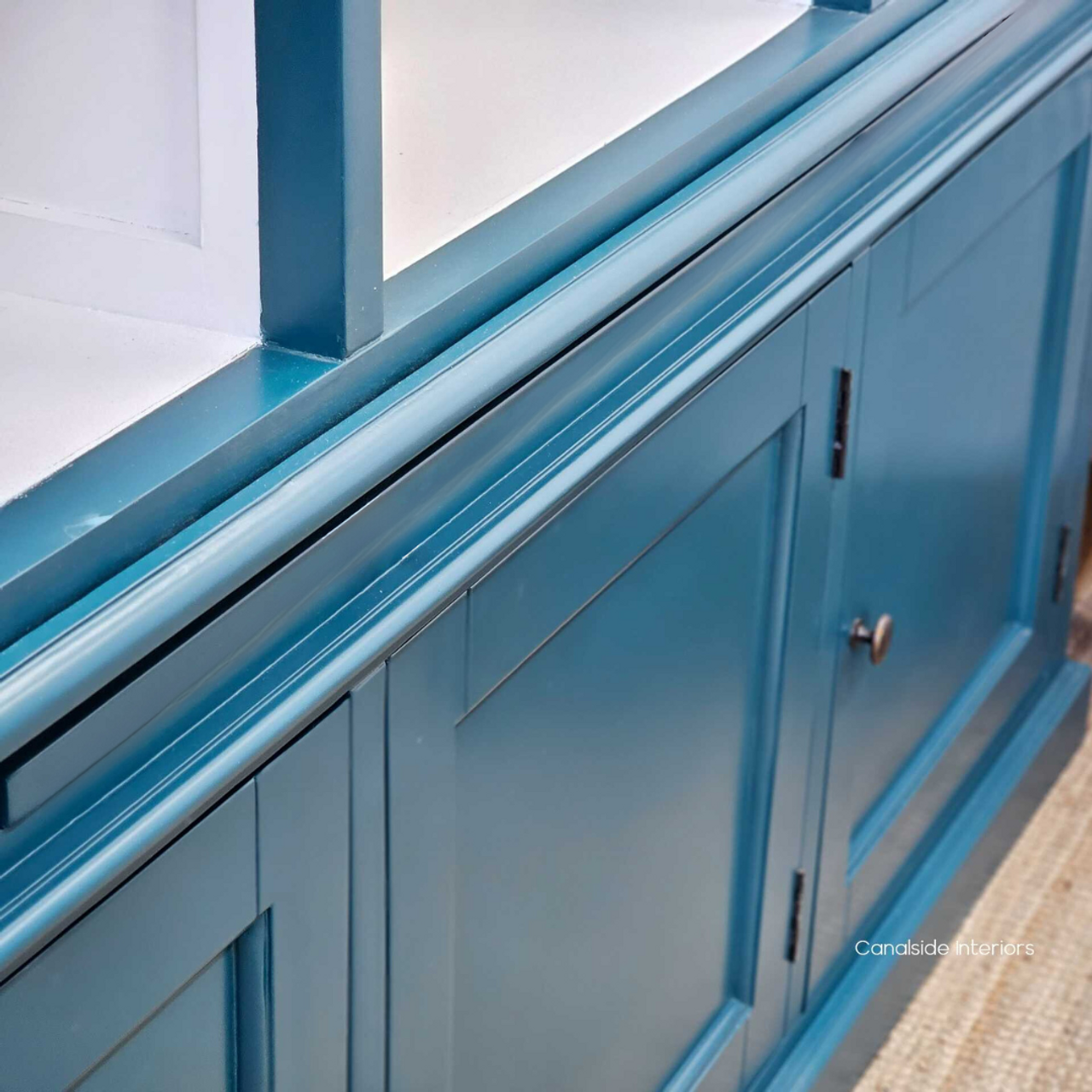 The Grange Bookcase's stature is featured, demonstrating its commanding presence in a library or home office - Canalside Interior