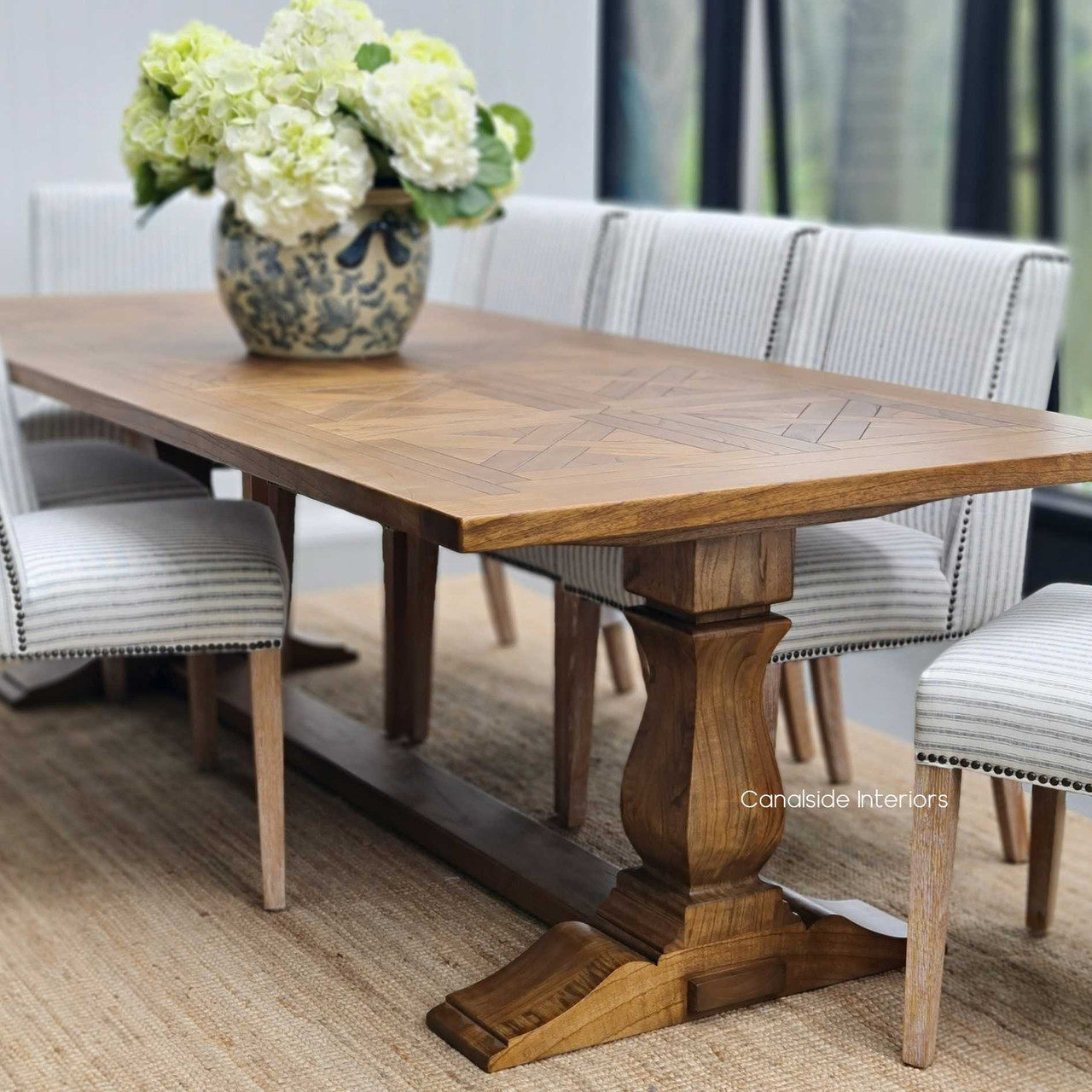 View of the Stamford Parquetry Dining Table from Canalside Interiors, showcasing the artisanal parquetry top and timeless design.