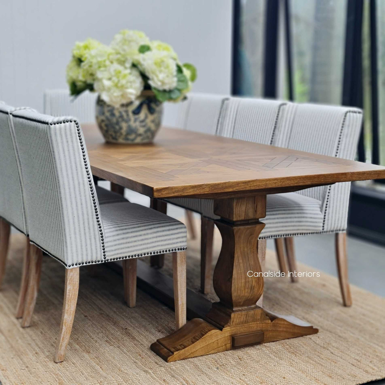 Angled view of the Stamford table, emphasizing its grand size and suitability for both traditional and contemporary dining rooms.