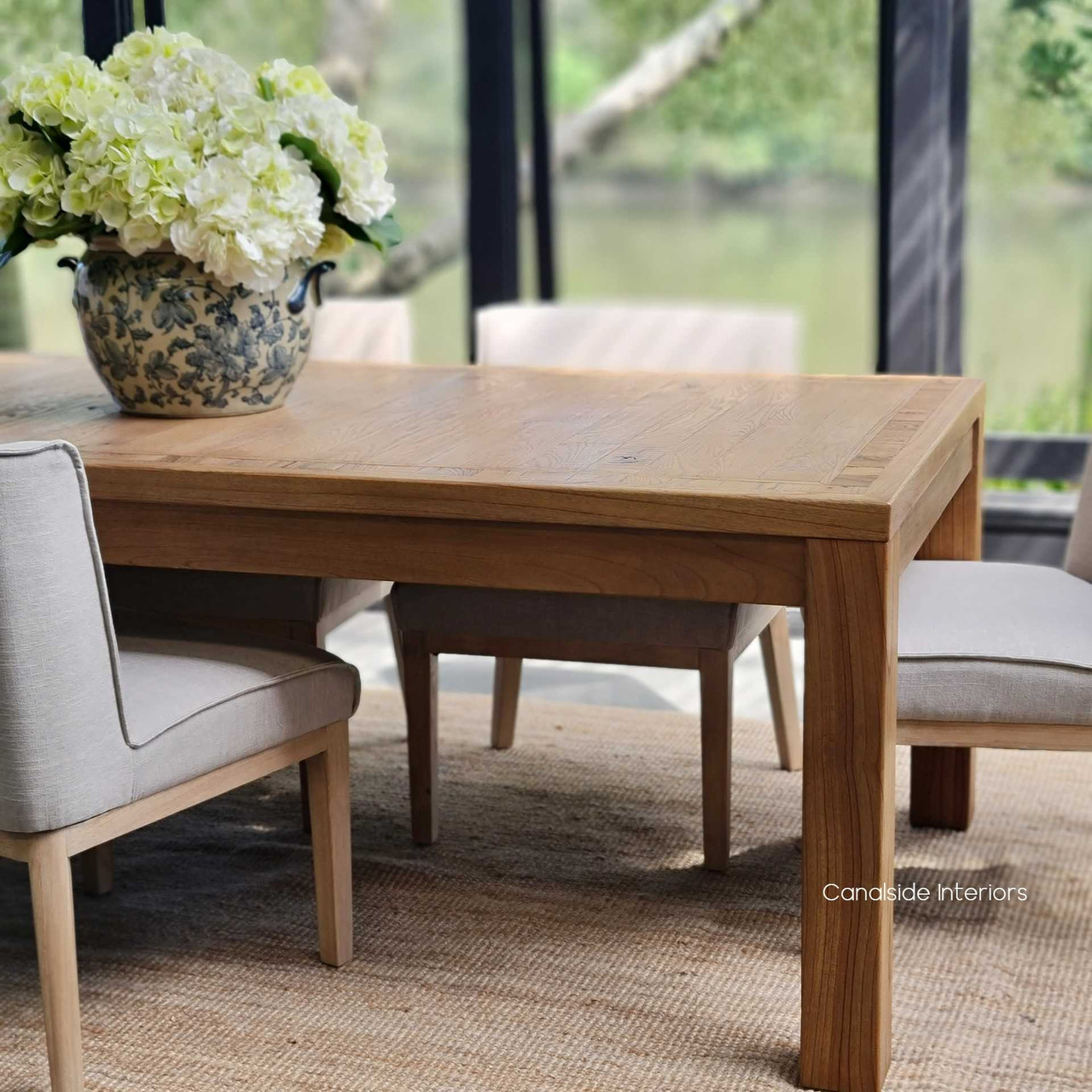 Angled shot showing the Hayworth table's capacity for large gatherings, exemplifying its functional design and relaxed luxury.