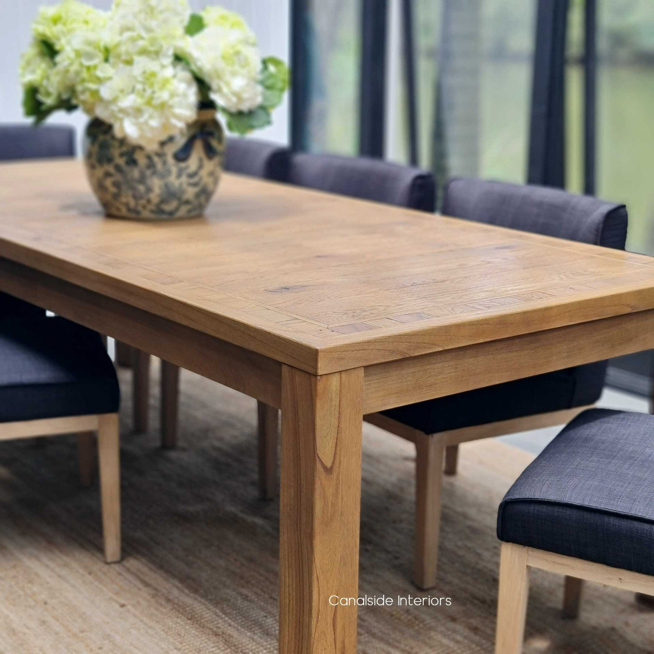 Full display of the Hayworth Dining Table set for an elegant dinner, embodying contemporary luxury.