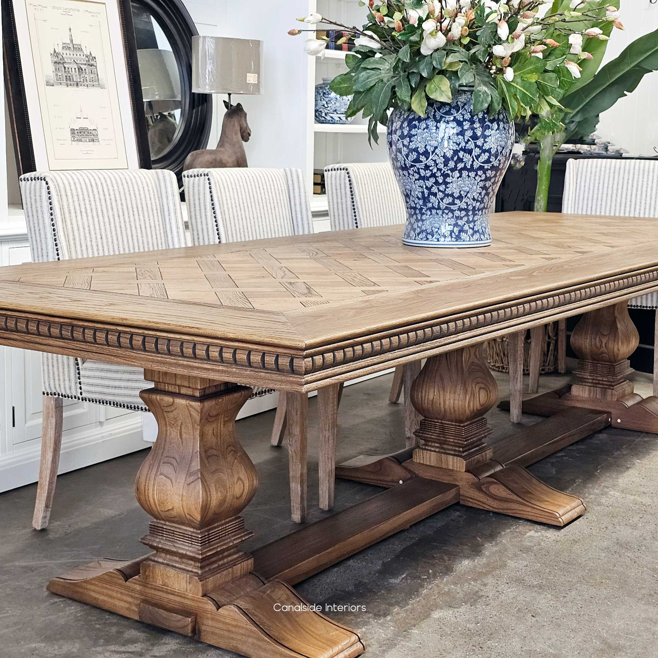 The table's presence in a coastal-inspired dining area, blending seamlessly with Hamptons-style interiors.