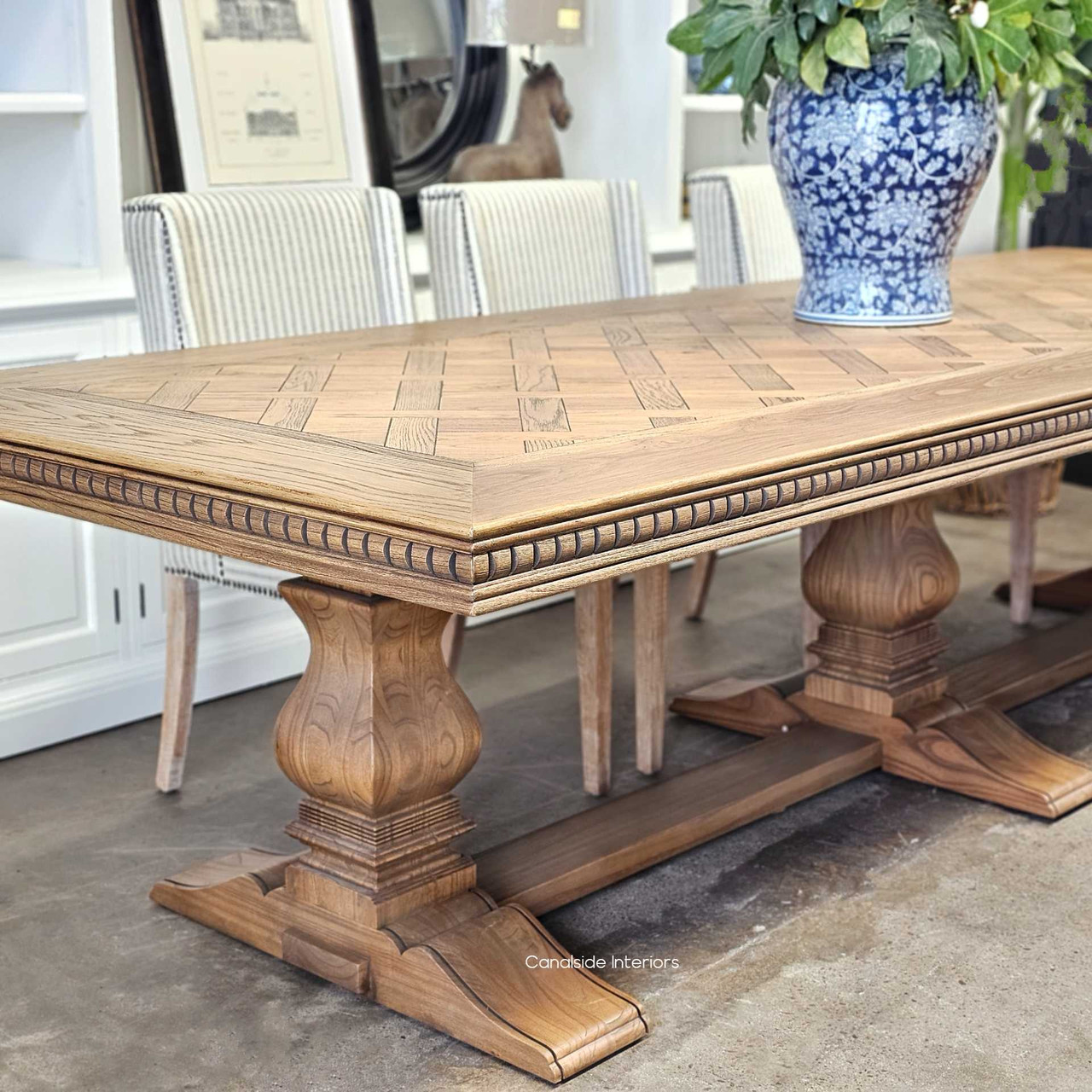 The table set against a minimalist backdrop, demonstrating its versatility and appeal in various home decors.
