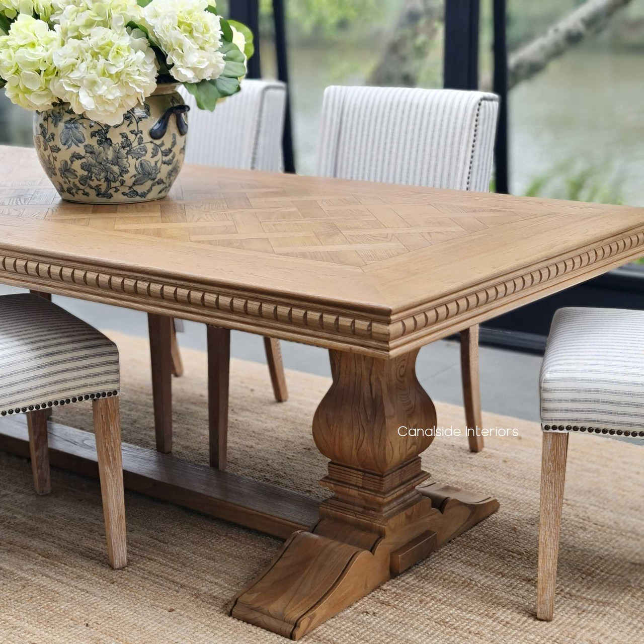 The Berenson Oak Table captured in a chic, contemporary setting, emphasizing its modern timeless appeal.