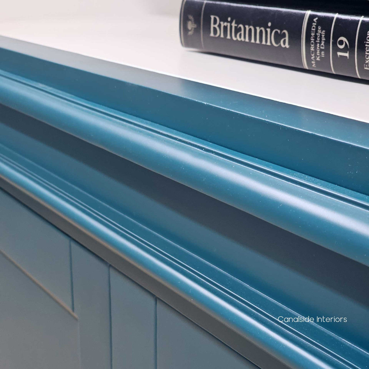 Texture and Finish Quality Close-Up - A macro shot that captures the intricate texture and high-quality finish of the teal green paint. This image illustrates the subtle variations in hue and the smooth surface, emphasising the unit's luxurious feel and visual appeal.