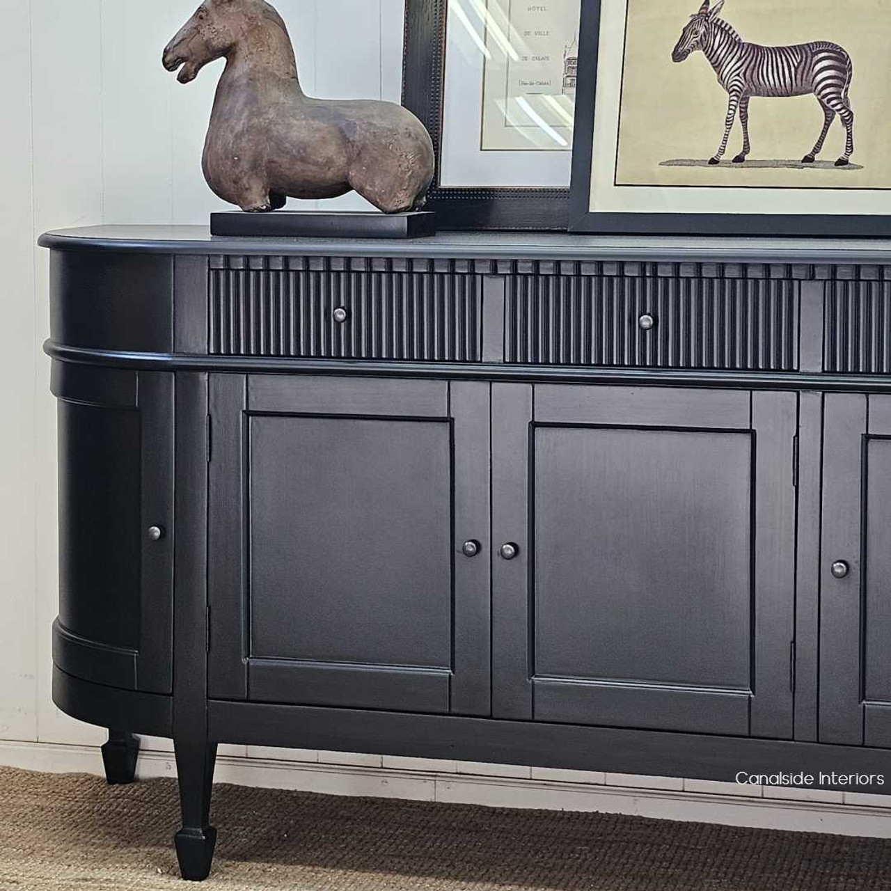 Close-up of the curved side panel of the Louis Curved Buffet, emphasising the craftsmanship.