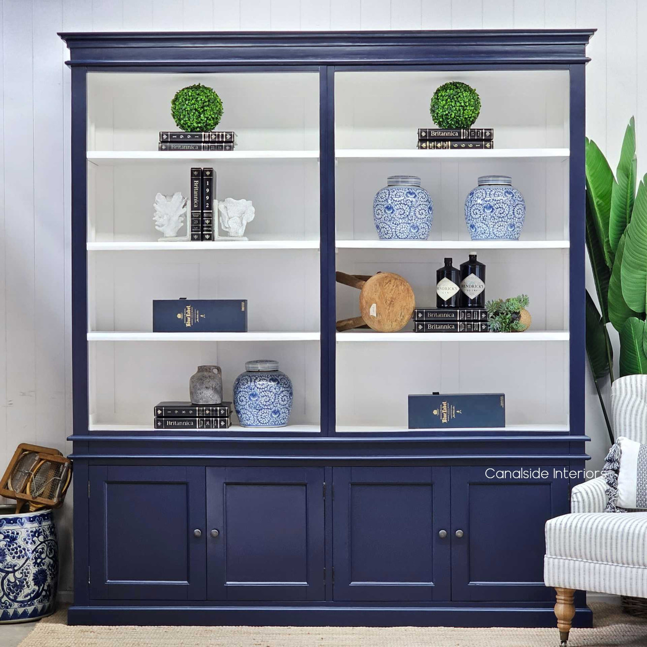 Front view of the Grange Wall Unit showcasing its elegant navy blue exterior with a contrasting white interior.