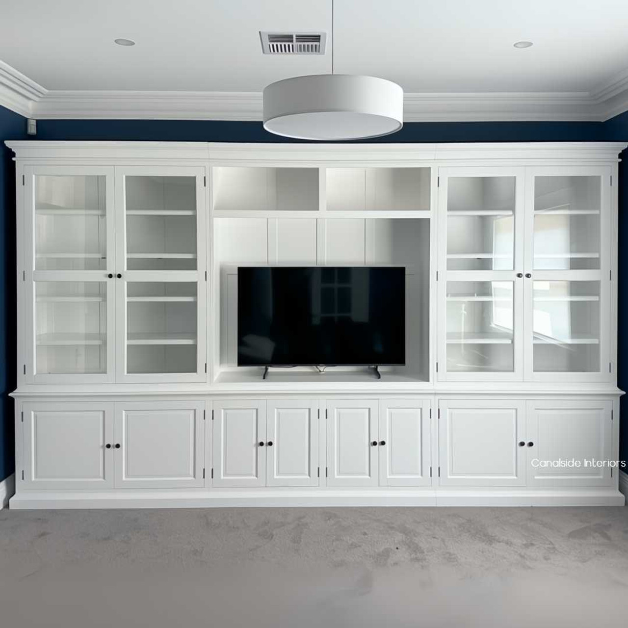 Front view of a freestanding custom Casement TV Media Wall Unit in a home setting, showcasing spacious shelving and premium craftsmanship for stylish storage.