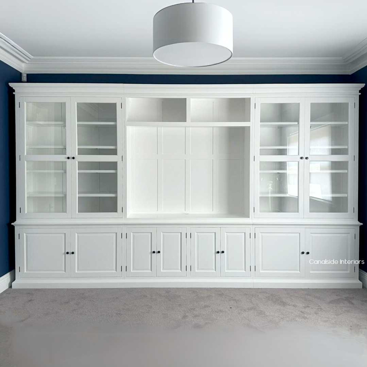 Custom-built Casement TV Entertainment Wall Unit with Glass Doors for Display with adjustable shelves and sleek cabinetry, designed for versatile storage in any room of the home.