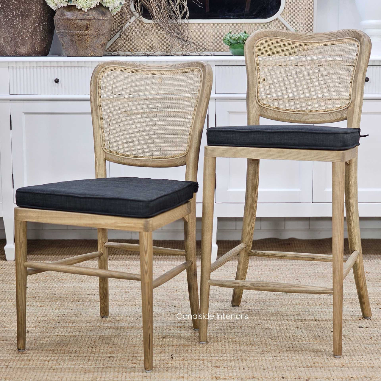 Angled image showing the Noda Chair and Noda Stool with removable Black seat cushions showing their contemporary styling