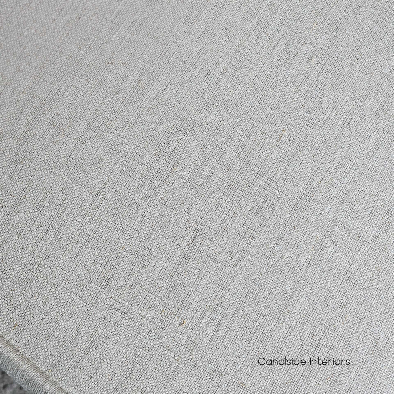 Close-up of the Noda Oak Rattan Dining Chair’s seat cushion, highlighting the plush cream upholstery and expertly tailored finish.
