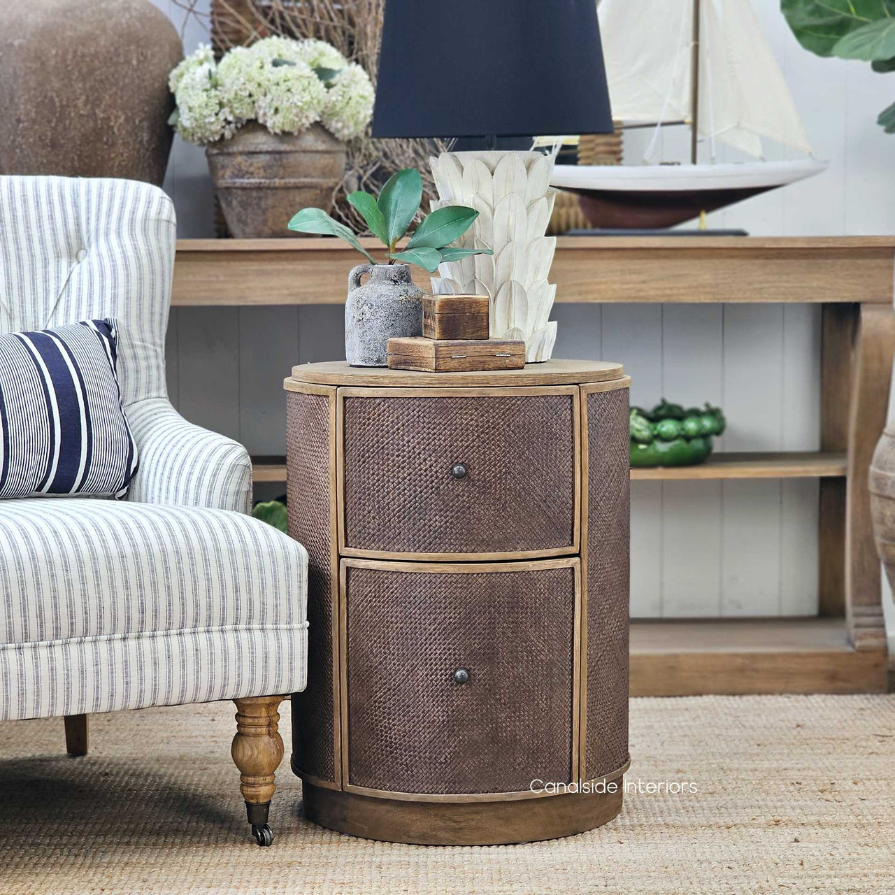 Front view of the Langston Rattan Side Table displaying the smooth oak surface and organic textures.