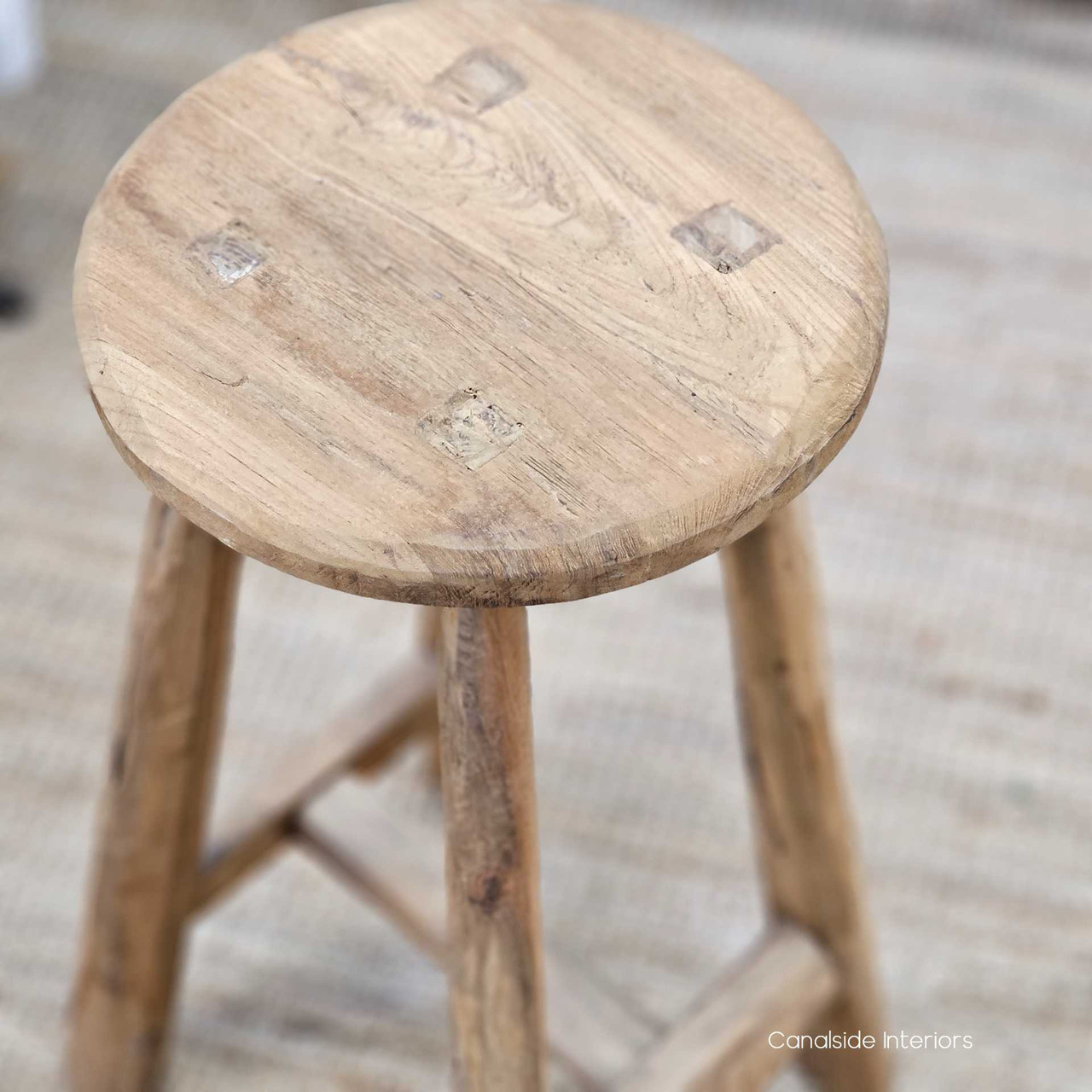 Close-up of the Vintage Teak Kitchen Stool’s seat, showing its hand-finished details and natural wood imperfections.