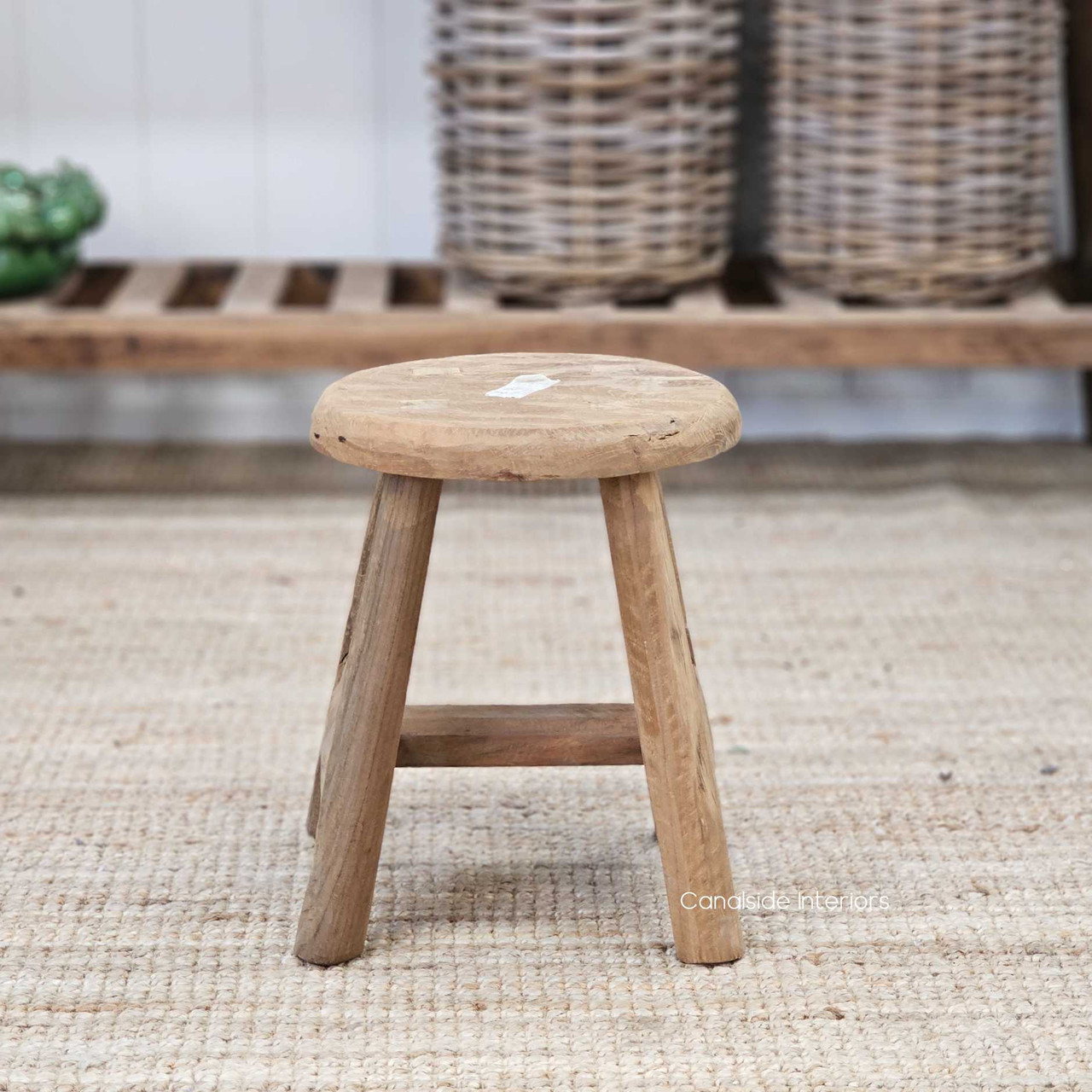 Front view of the lower Vintage Teak Round Stool, highlighting its compact proportions and rich, weathered teak finish.
