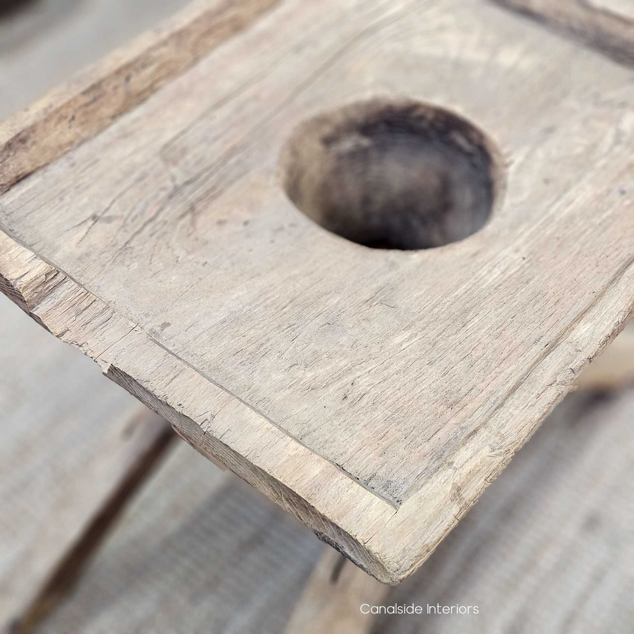 Close-up of the natural imperfections and markings on the Vintage Teak Lumpang Coffee Table, celebrating its history and craftsmanship.