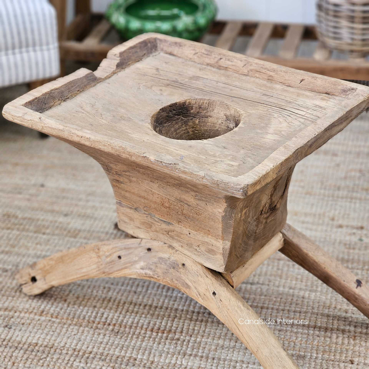 Low-angle shot of the Vintage Teak Lumpang Coffee Table, showcasing its robust frame and rustic elegance.