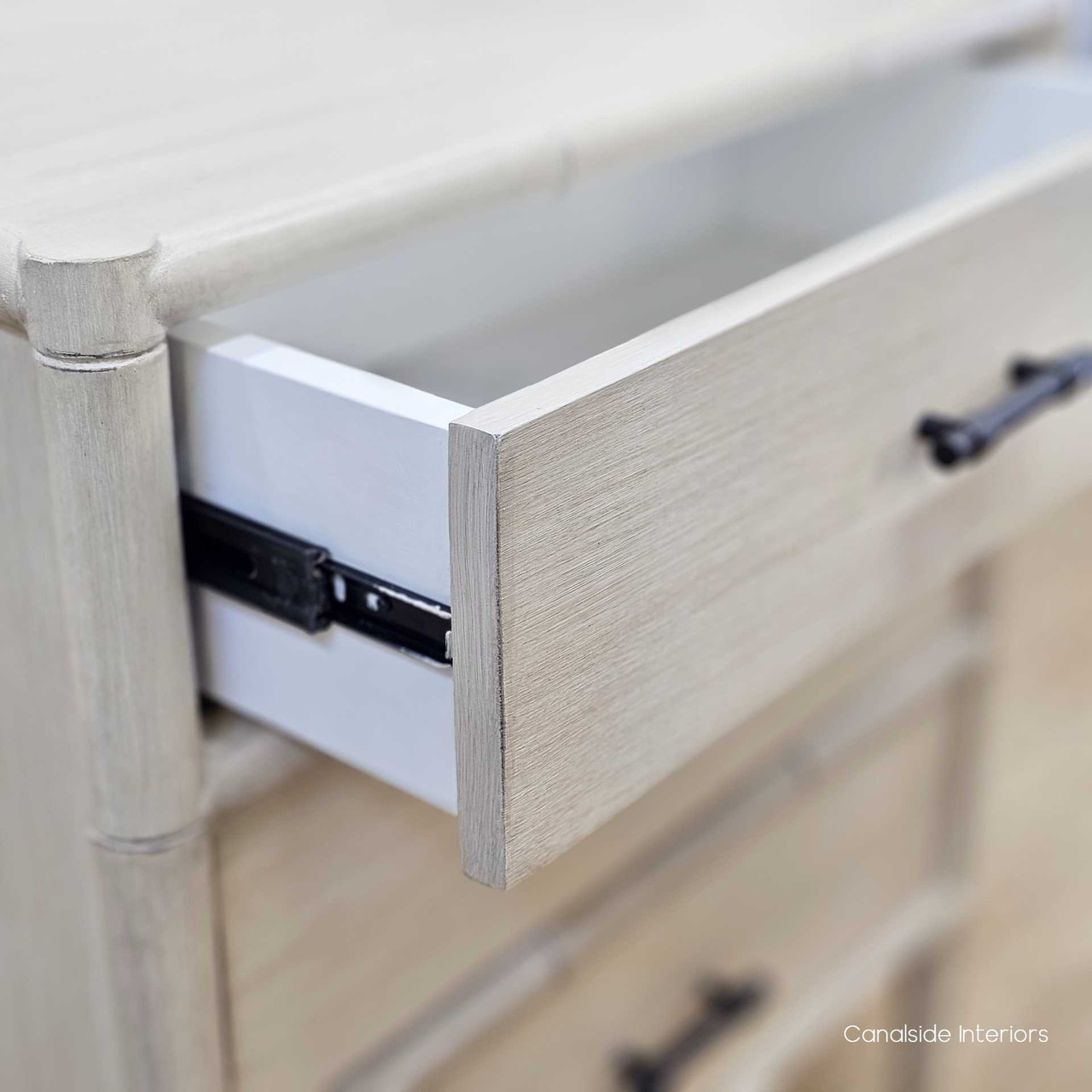 Lalise 3-Drawer Bedside Table with drawers open, showcasing the spacious storage compartments and smooth metal runners.