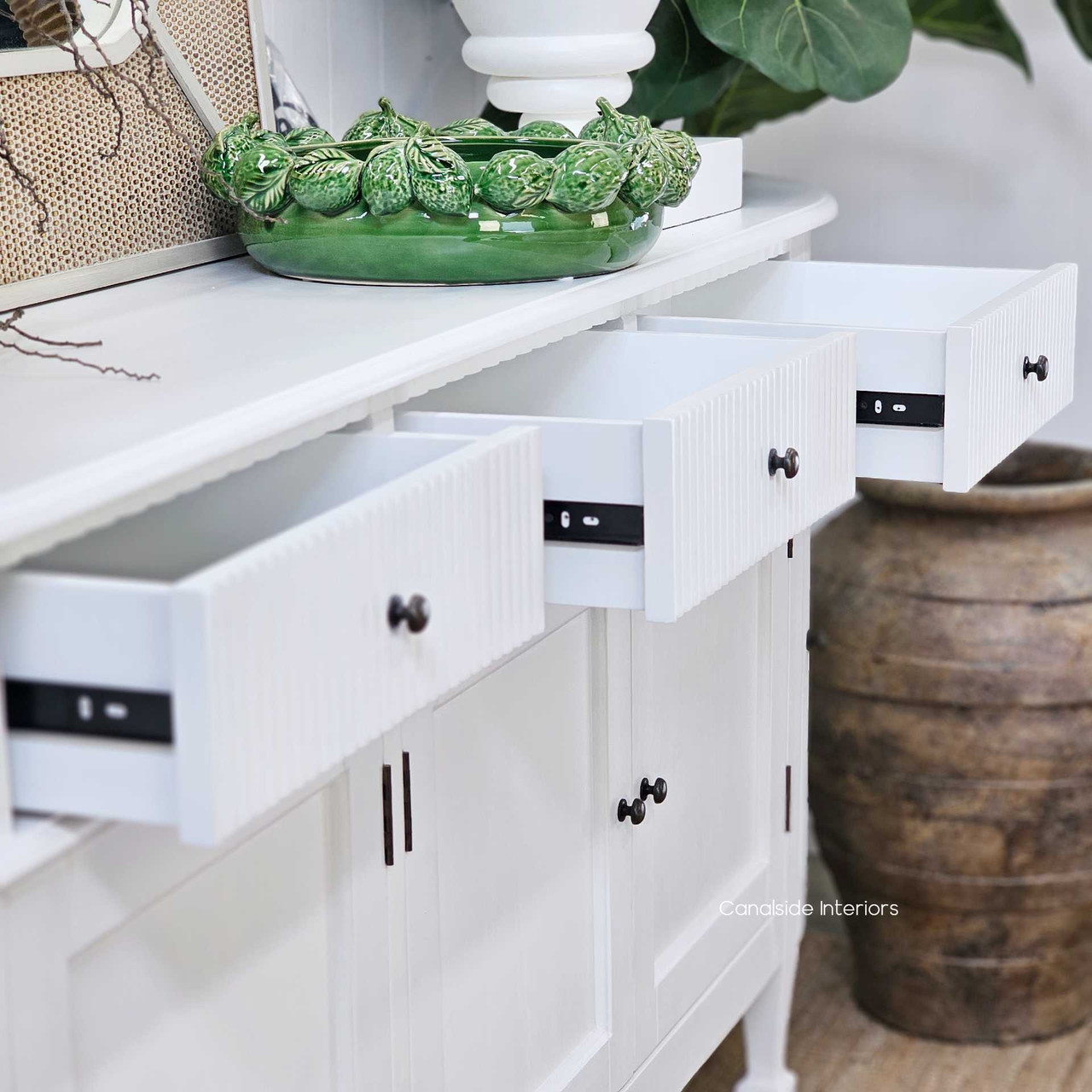 Close-up of the Louis Curved Sideboard’s drawers, highlighting their smooth-glide functionality and ample space.