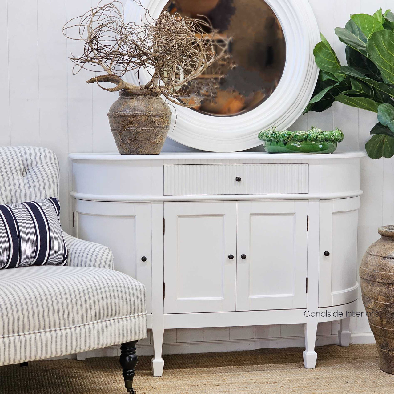 Side profile of the Louis Curved 130cm Sideboard, emphasising its curved edges and sculptural form.