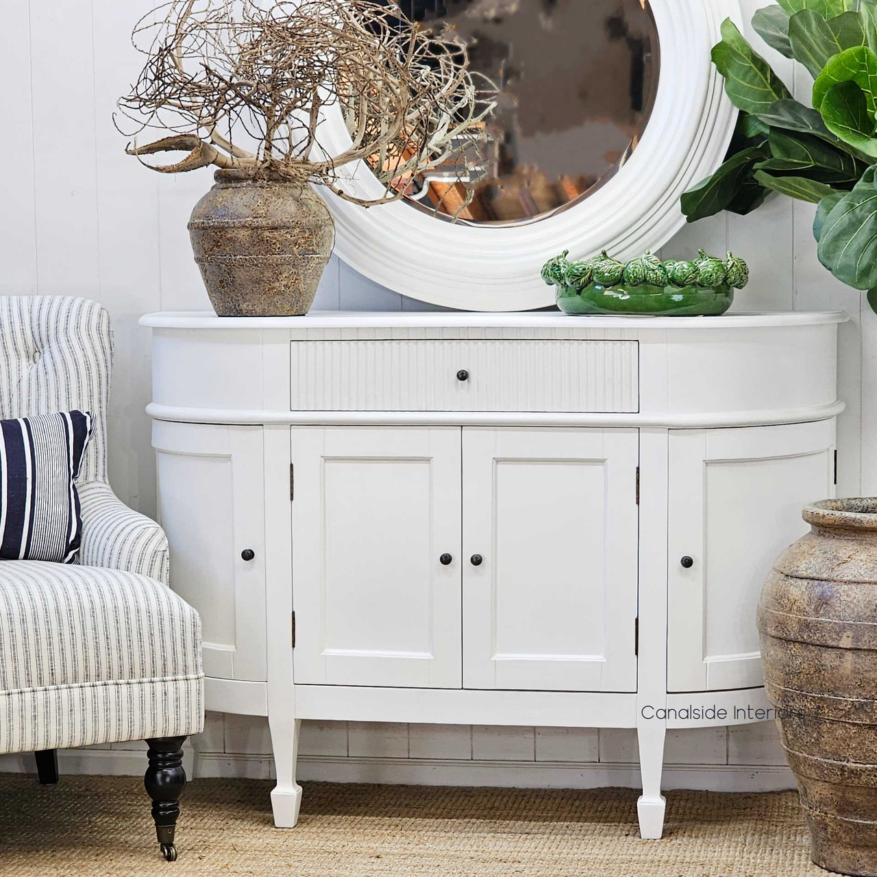 Angled front view of the Louis Curved 130cm Sideboard, highlighting the smooth white finish and classic silhouette.