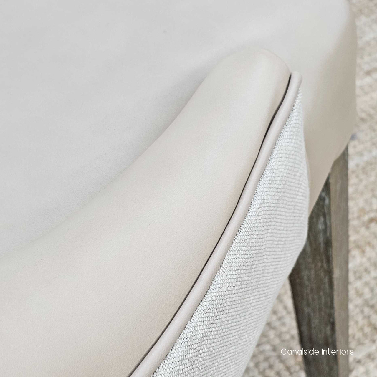 Low-angle view of the Aston Chair, drawing attention to the graceful curve of the backrest.