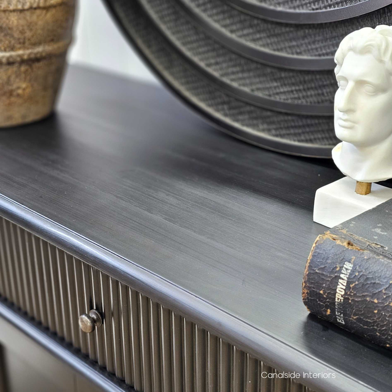 Close-up of the Louis Curved Sideboard’s ribbed fluting, showcasing the intricate textural detail.