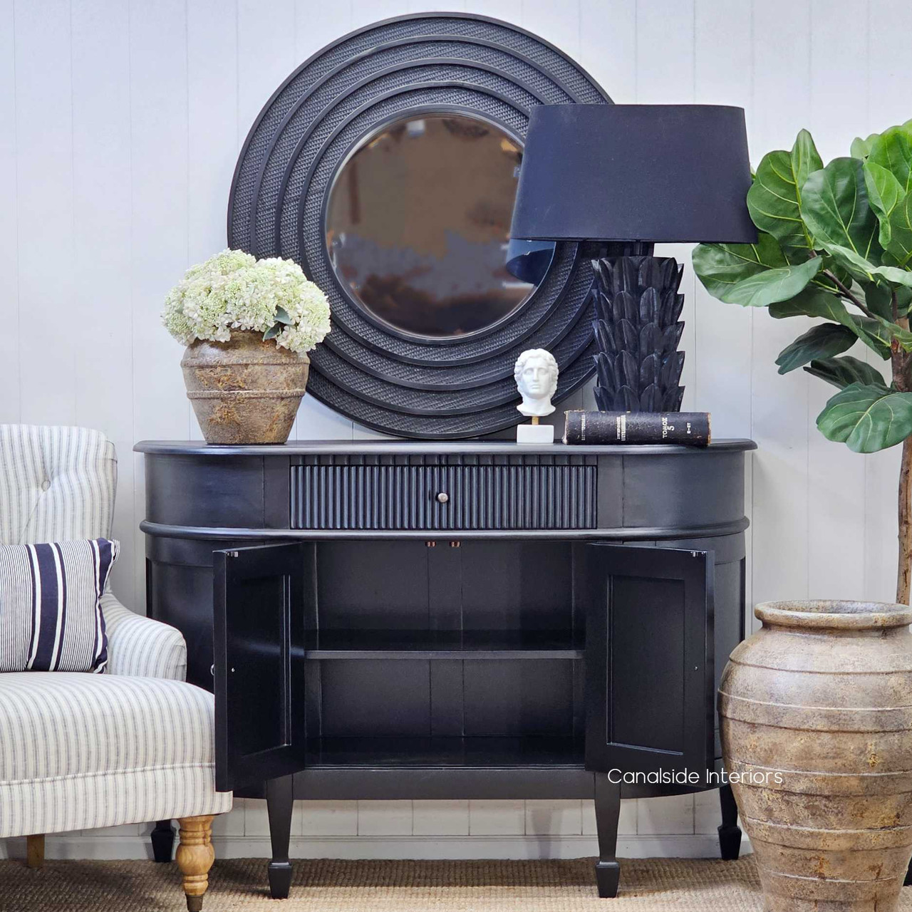 Front view of the Louis Curved Sideboard’s curved side cabinet doors open, revealing the generous storage