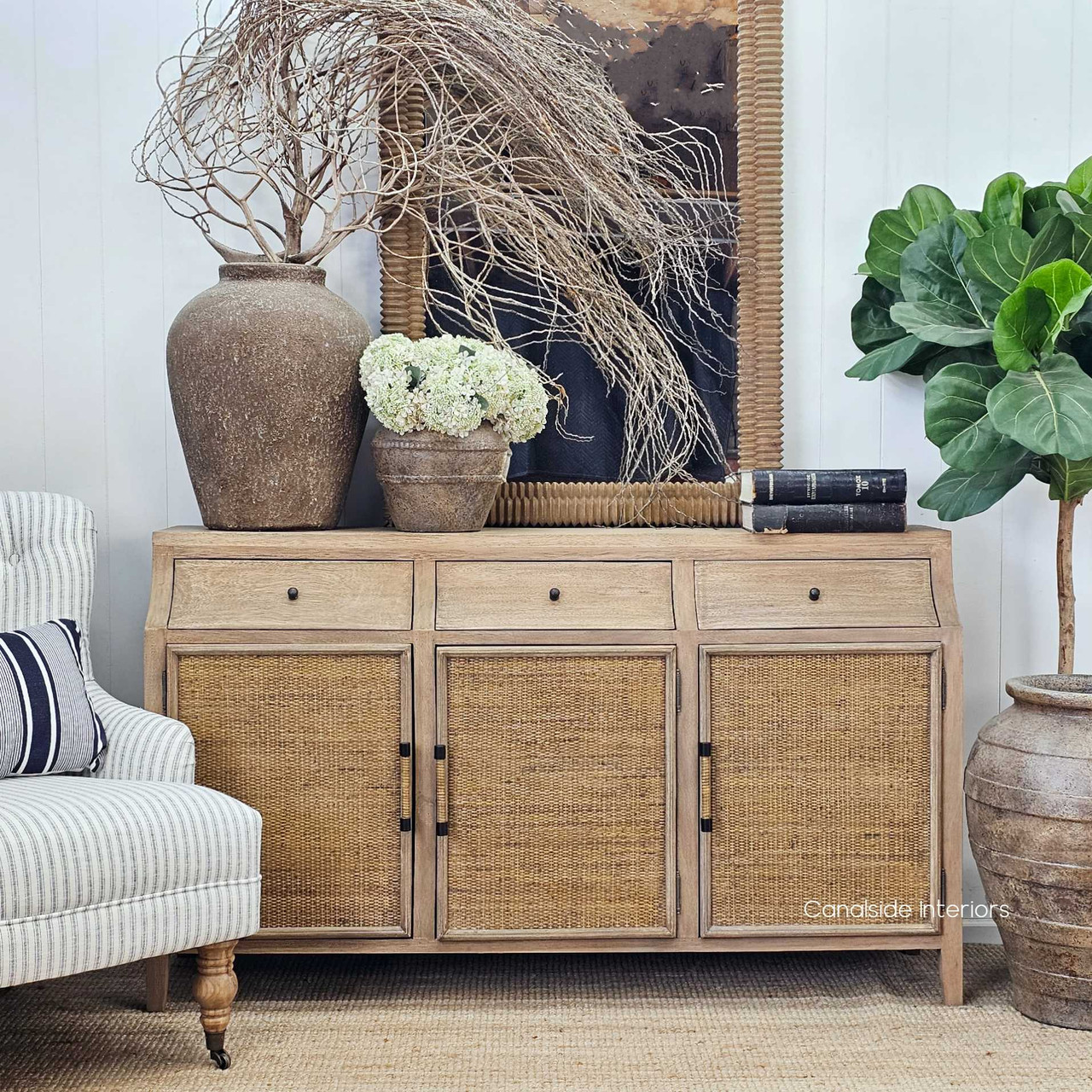 Sideboard placed under a statement mirror, showing balance in a Hamptons-inspired setting.
