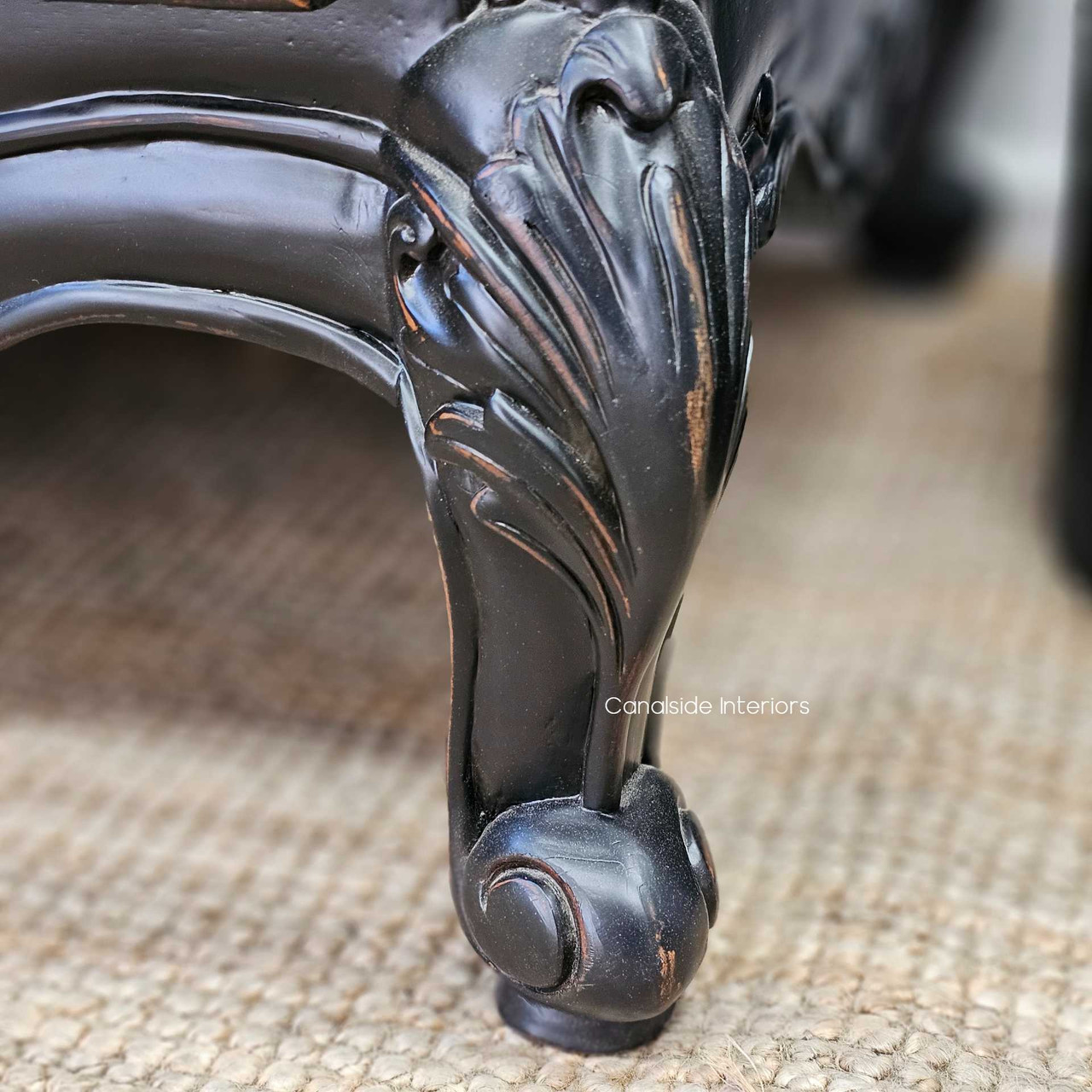 Detailed shot of the base carving and bun feet, emphasising the classic French styling.