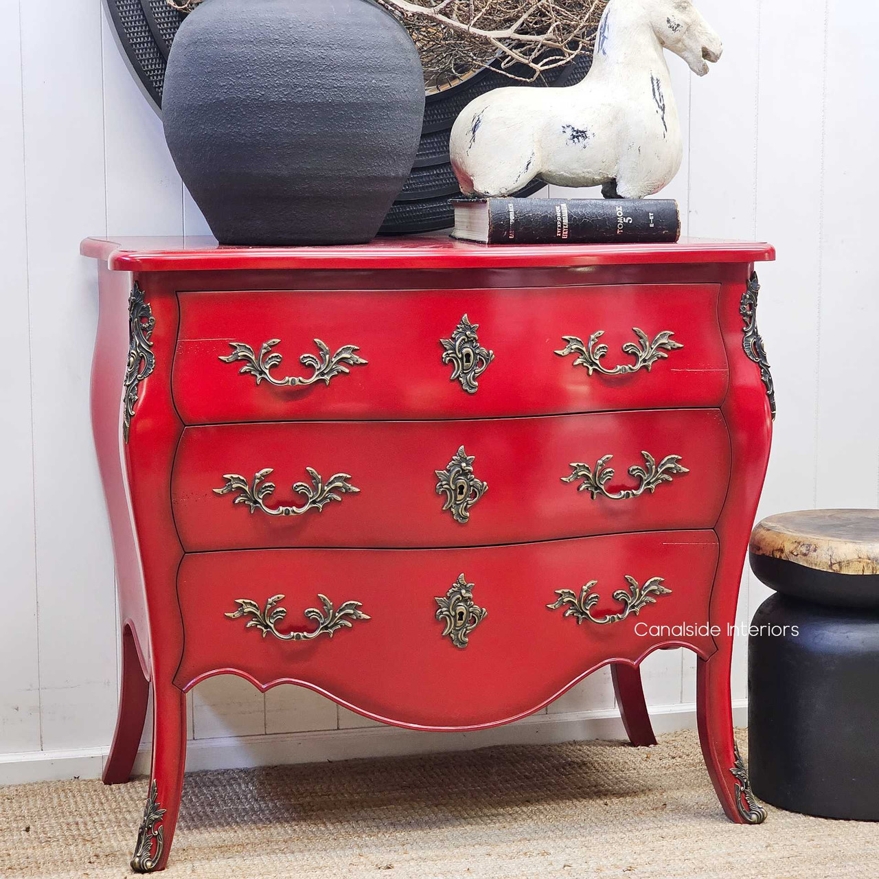 Angled front view, highlighting the depth of the red finish and soft fading toward the edges