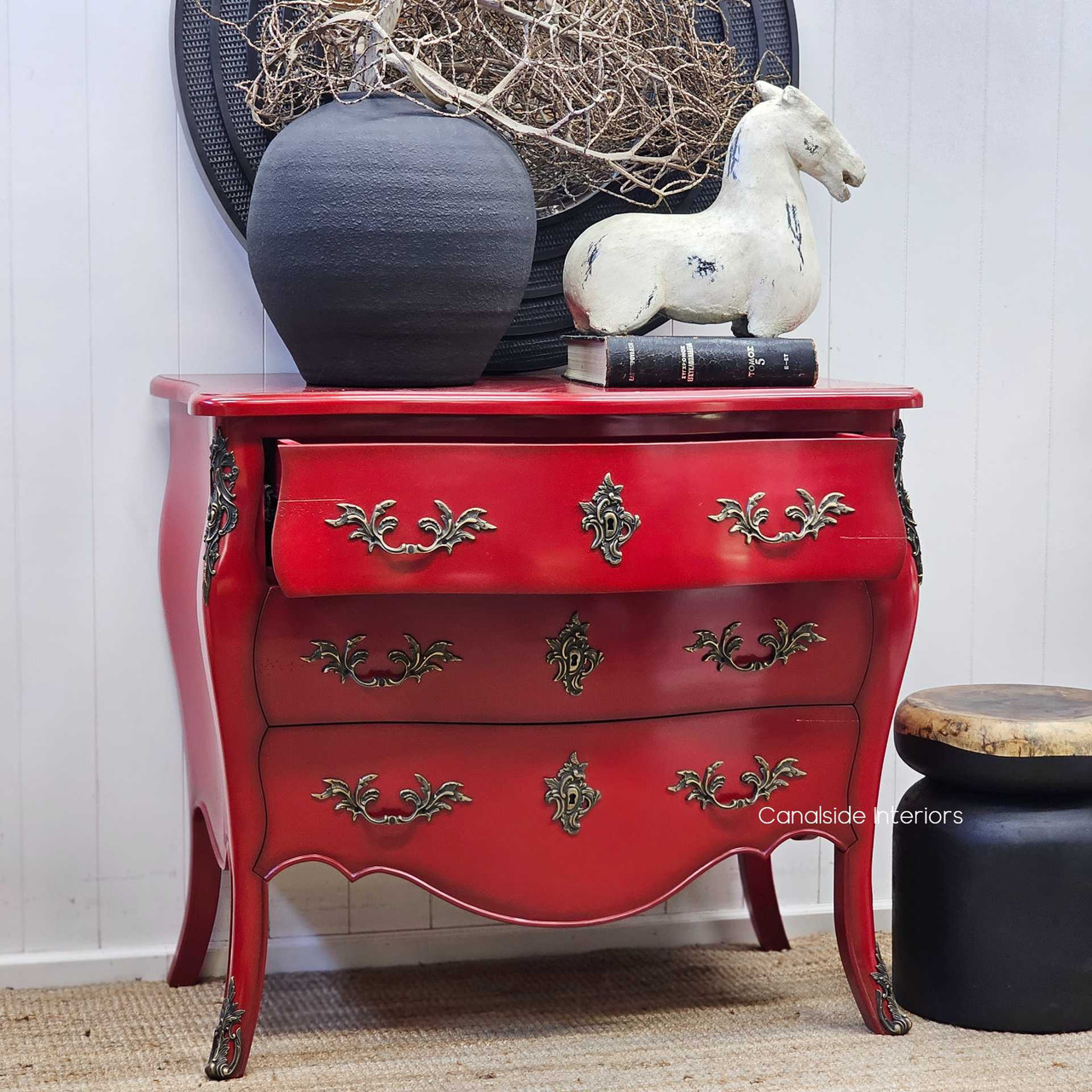 Close-up of one drawer partially open, showing the internal finish and practical storage space.