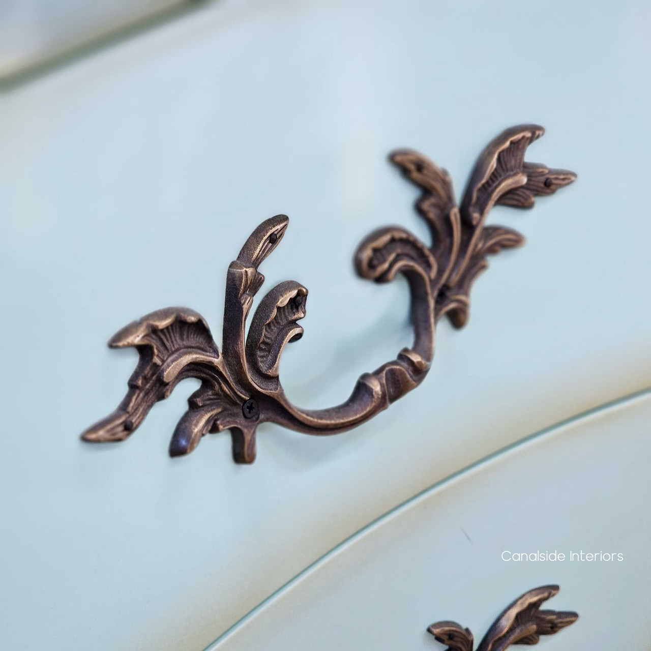 Zoomed-in image of the drawer fronts, showing the purposeful distressing, soft patina and aged colour variation.
