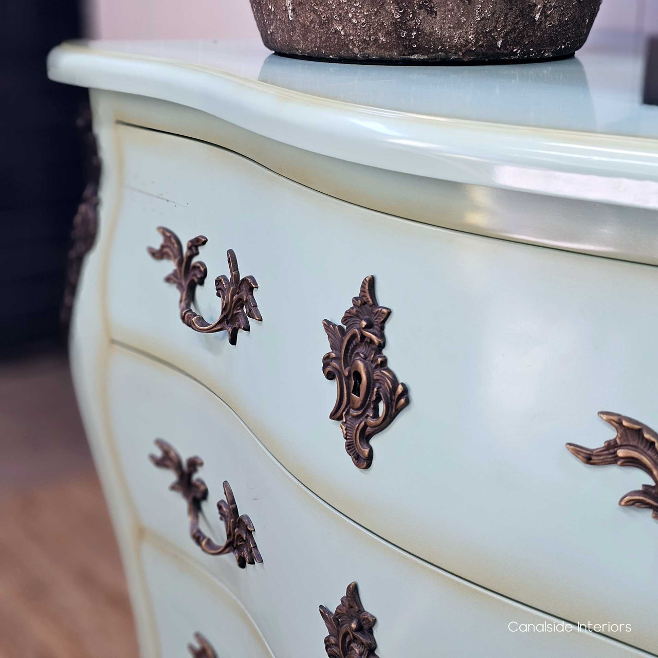 Close-up of drawer edges and gentle fade, showing subtle brushwork and vintage appeal.