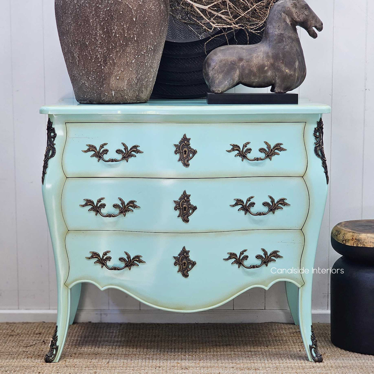 Shot with modern and antique pieces nearby, demonstrating versatility in layered interiors.