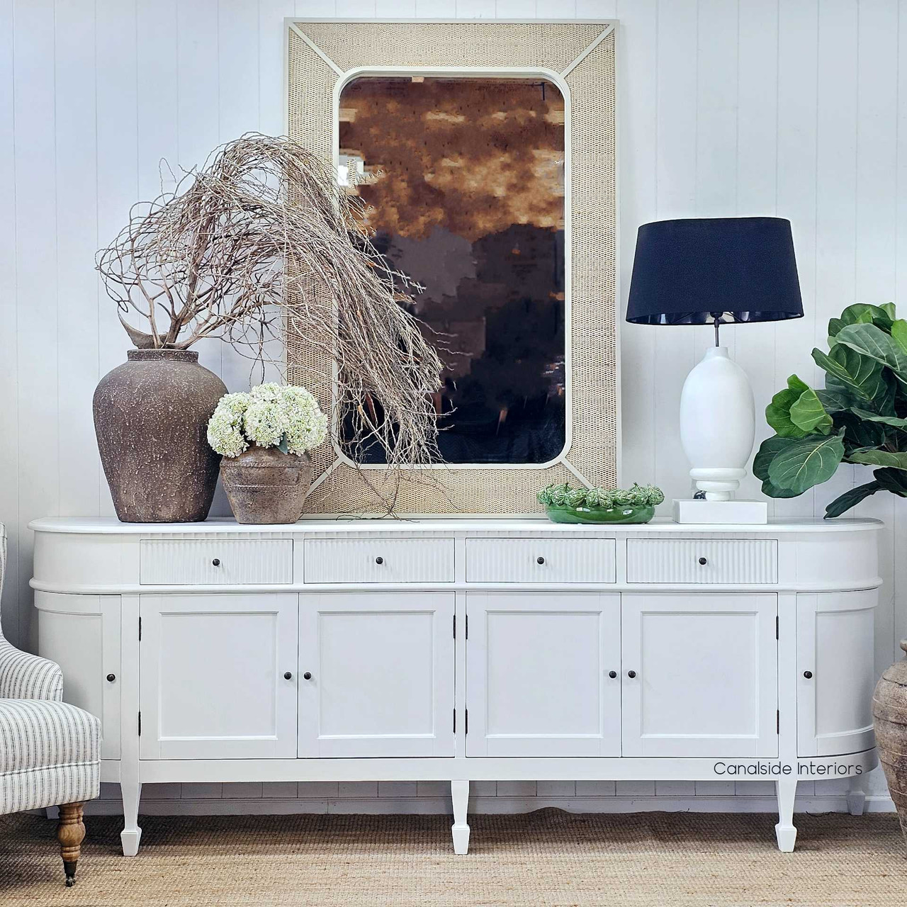 The Cordelle Vessel placed at centre stage on a white sideboard, with soft natural light enhancing its textured clay surface and understated artisan character.