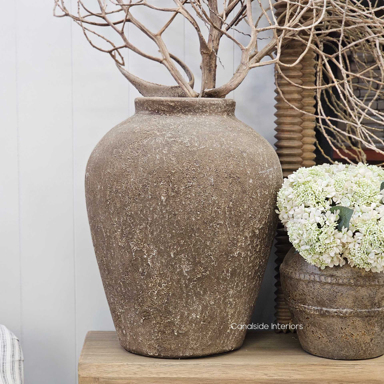 Interior scene with the Ayara Vessel on display, adding a sense of depth and grounding to the space.