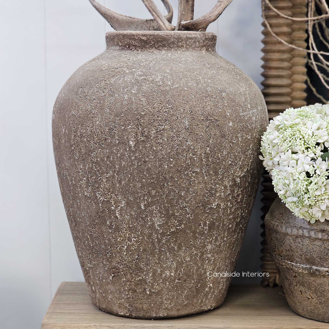 Three-quarter angled view of the vessel, capturing its balanced proportions and weathered finish.