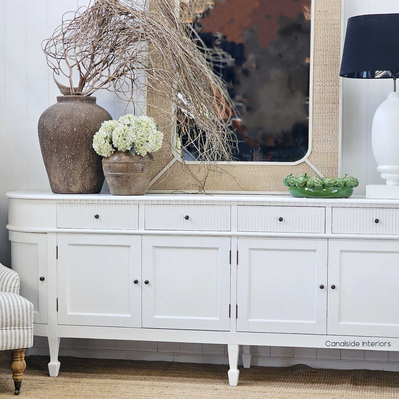 The Ayara Vessel set against a crisp white sideboard, offering a striking balance between rustic texture and clean lines—ideal for coastal, minimal, or modern classic spaces.