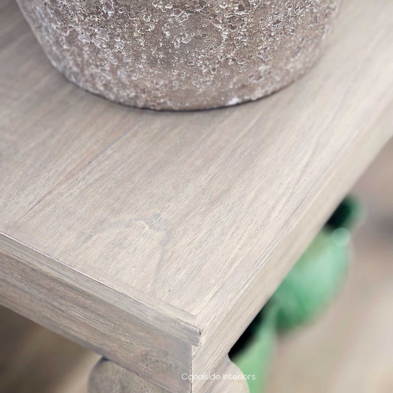 Close-up of the shelf joinery, revealing artisan construction and timber finish.