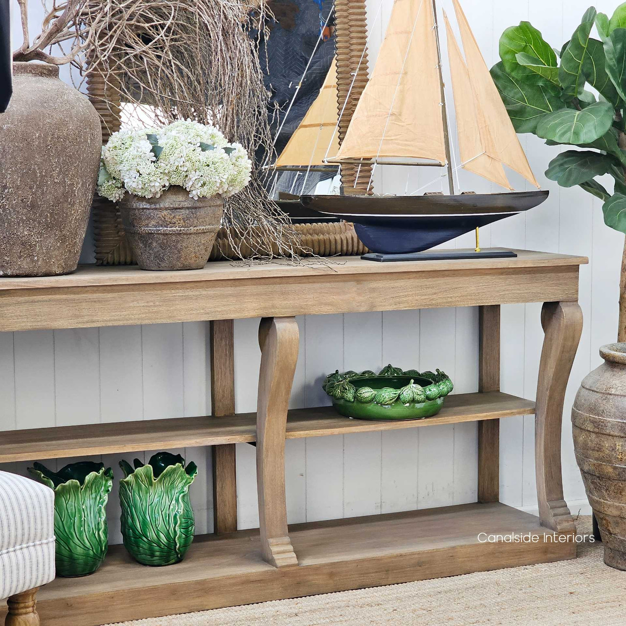 Angled view of the Bramwell Console, highlighting its open shelving and soft timber grain.