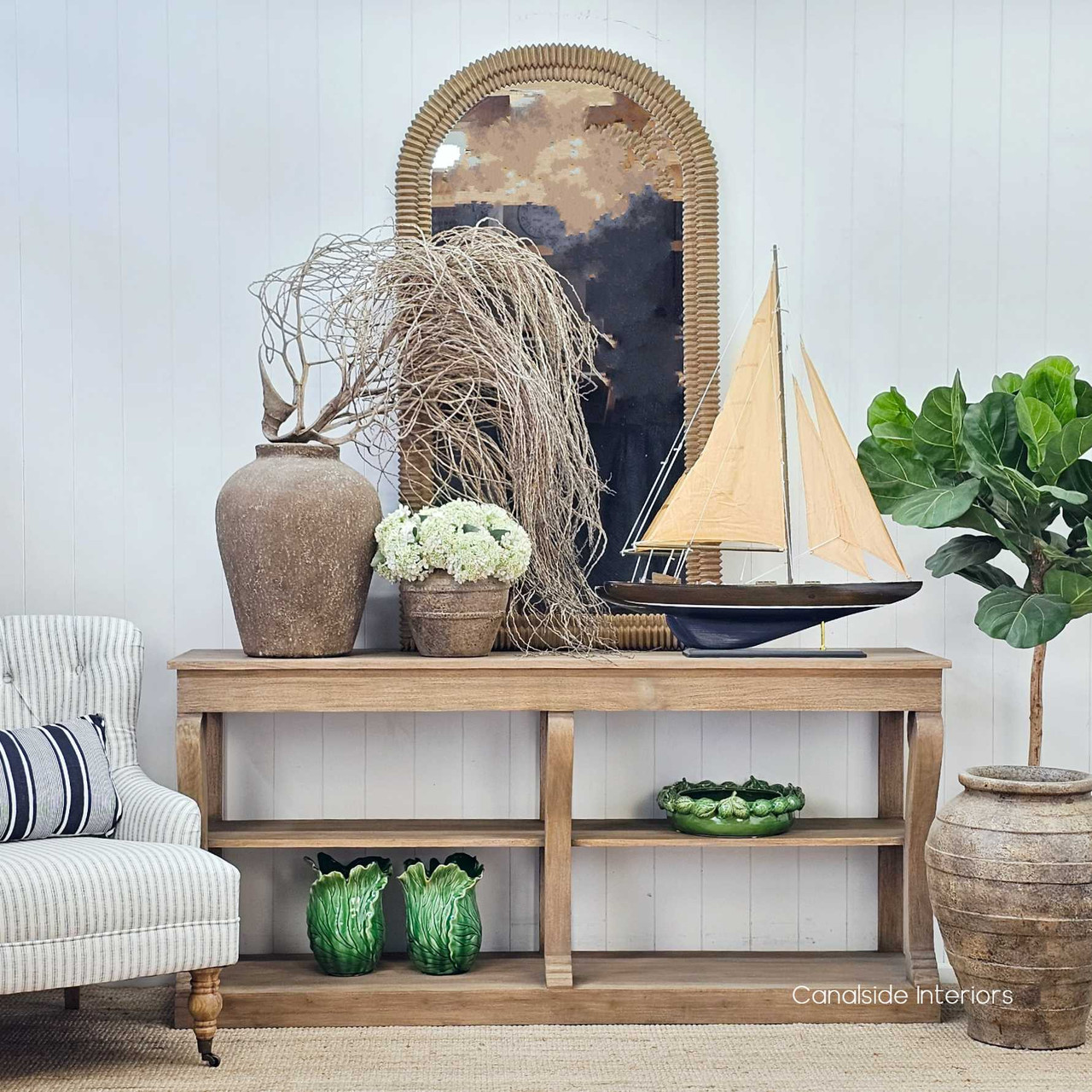 Bramwell Console styled against a white panelled wall, adding warmth and architectural structure.