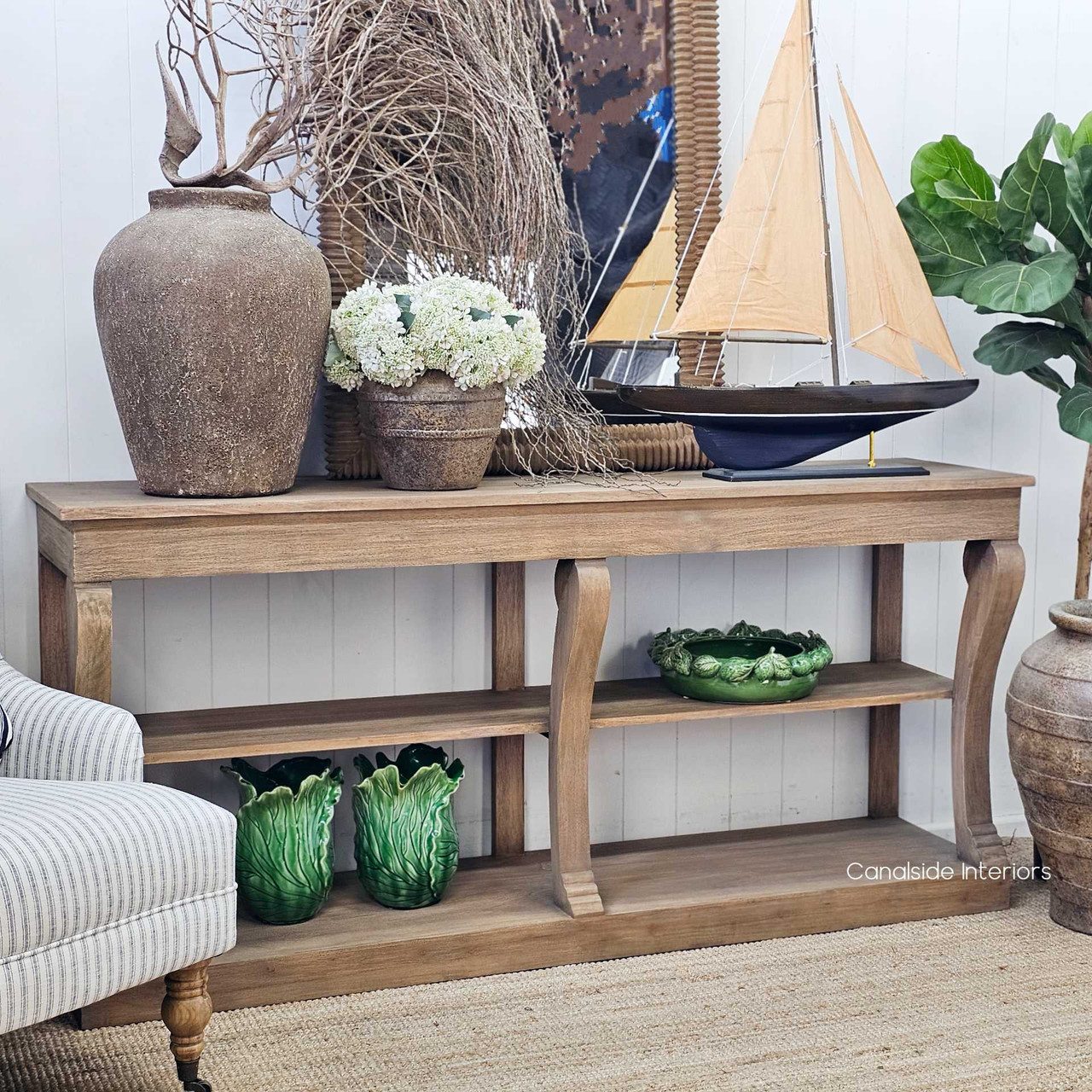 Bramwell Console with classic decor pieces, suited for modern traditional homes.