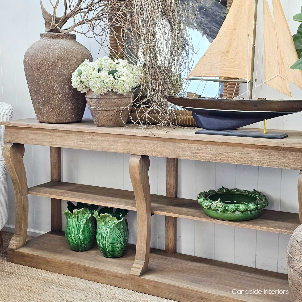 Detail of the bottom shelf with decorative objects, demonstrating styling versatility.