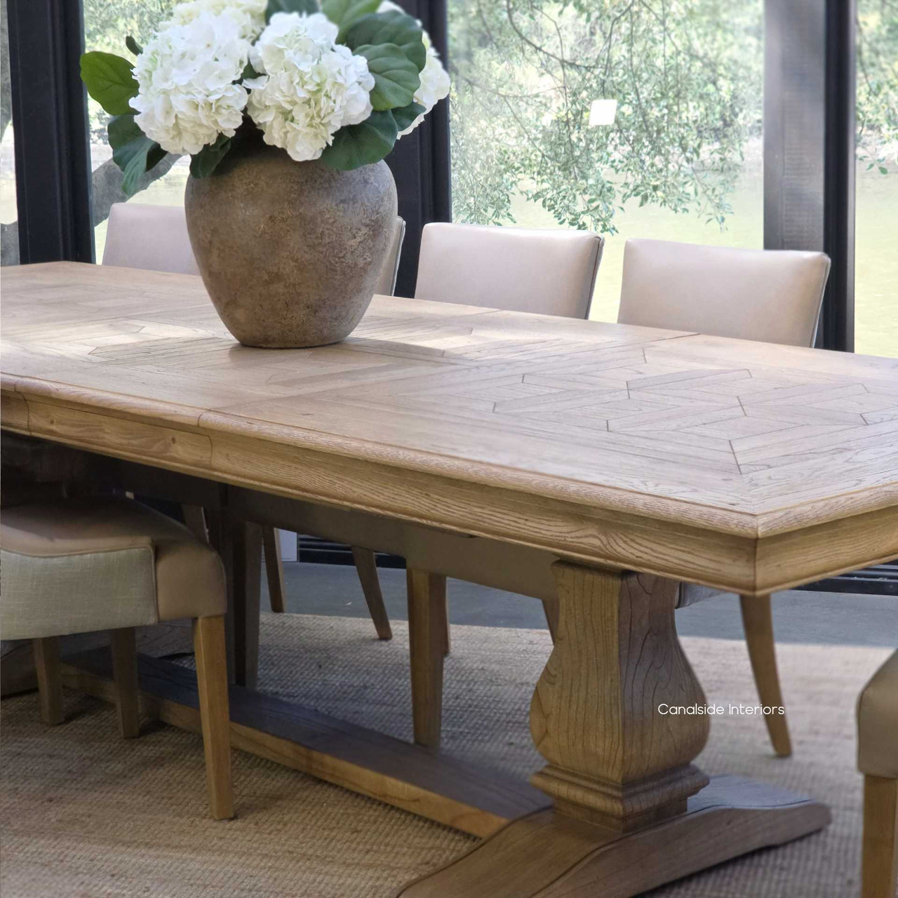 Chesterton oak parquetry dining table in a modern Hamptons-inspired dining room.