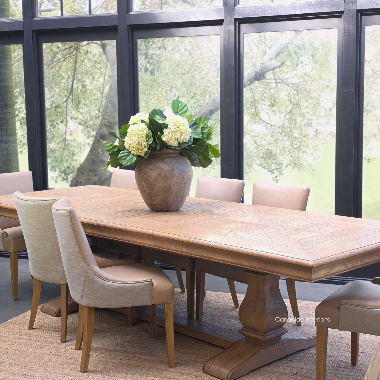 Side profile of the Chesterton Double Extension dining table with pedestal base.
