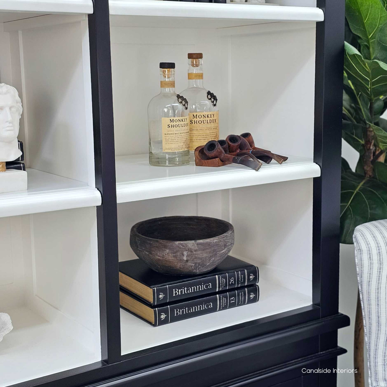 Fine close-up of interior shelf edge in white, highlighting trim and craftsmanship.
