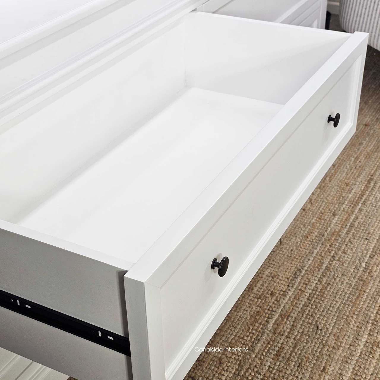 Drawer open showing interior timber detail and storage depth as well as metal drawer runners