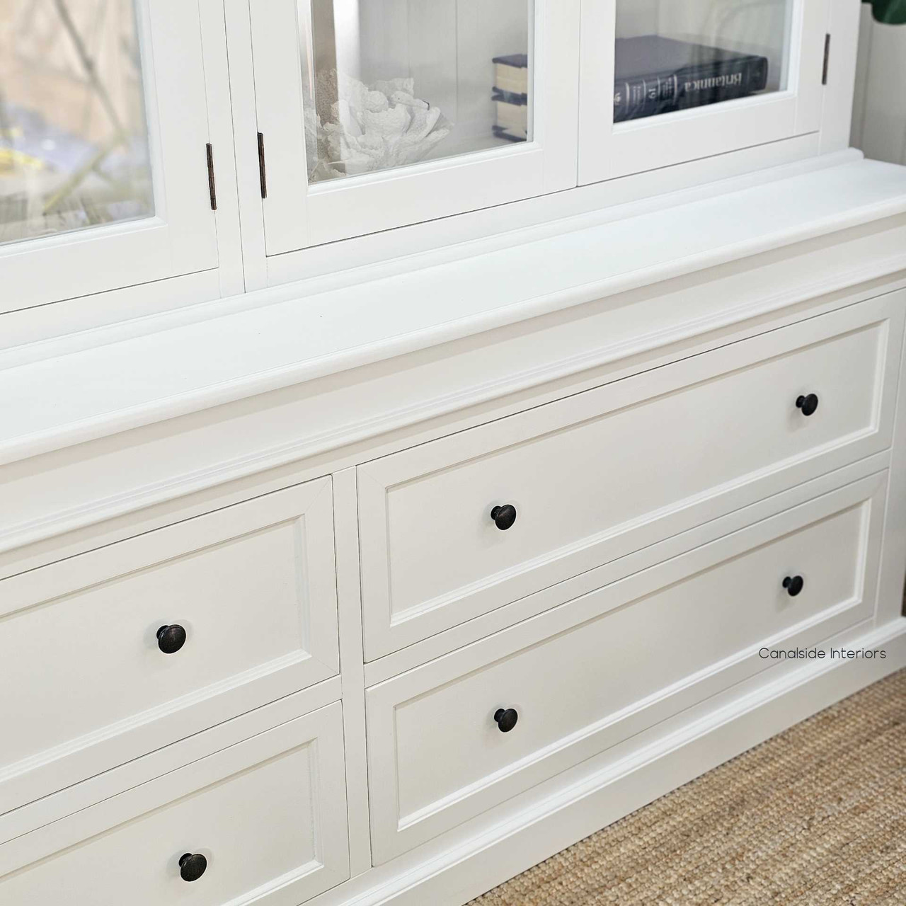 Base drawers photographed under direct light to show construction detail and clean lines.