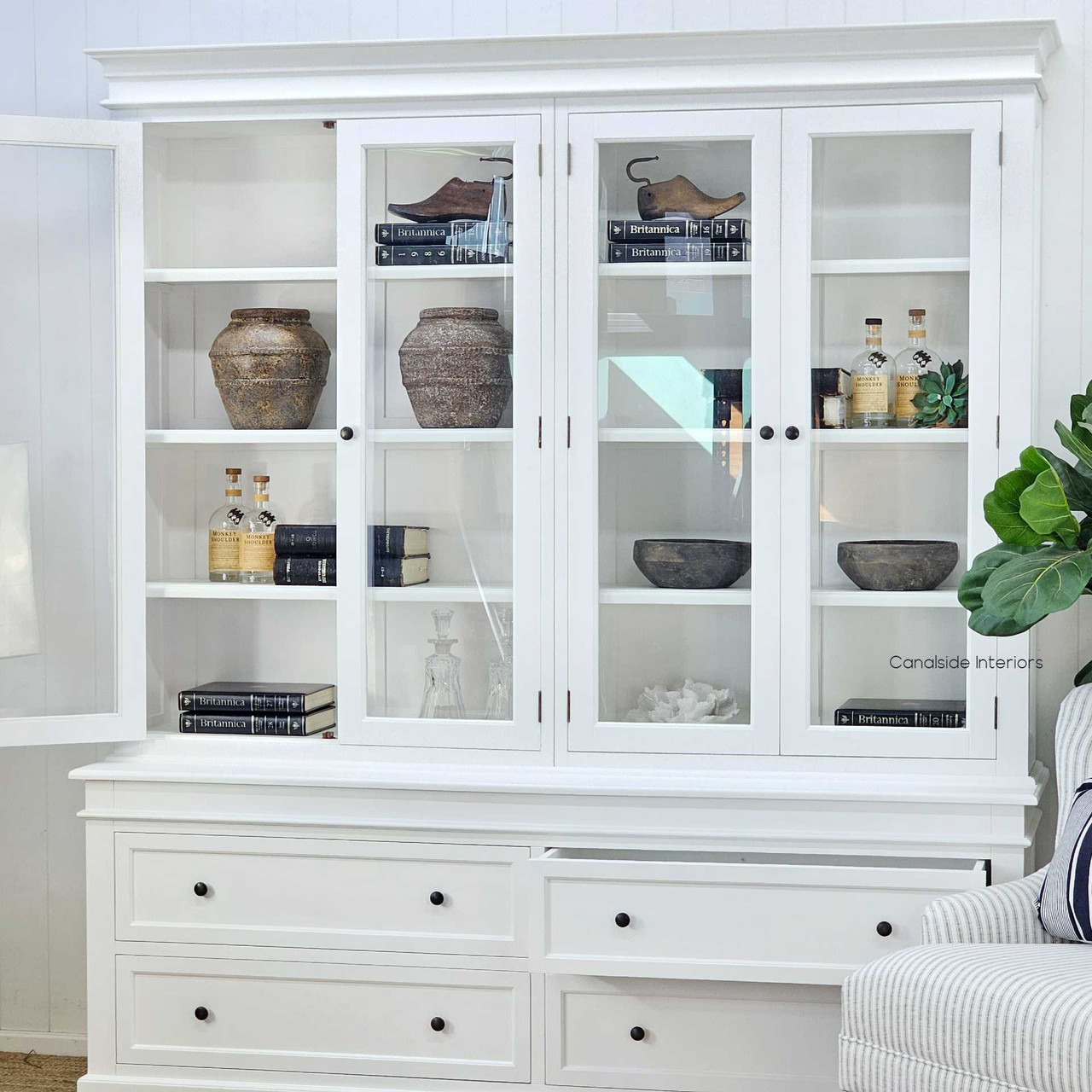 Side view styled in a coastal-themed space to show versatility of placement with hutch doors open