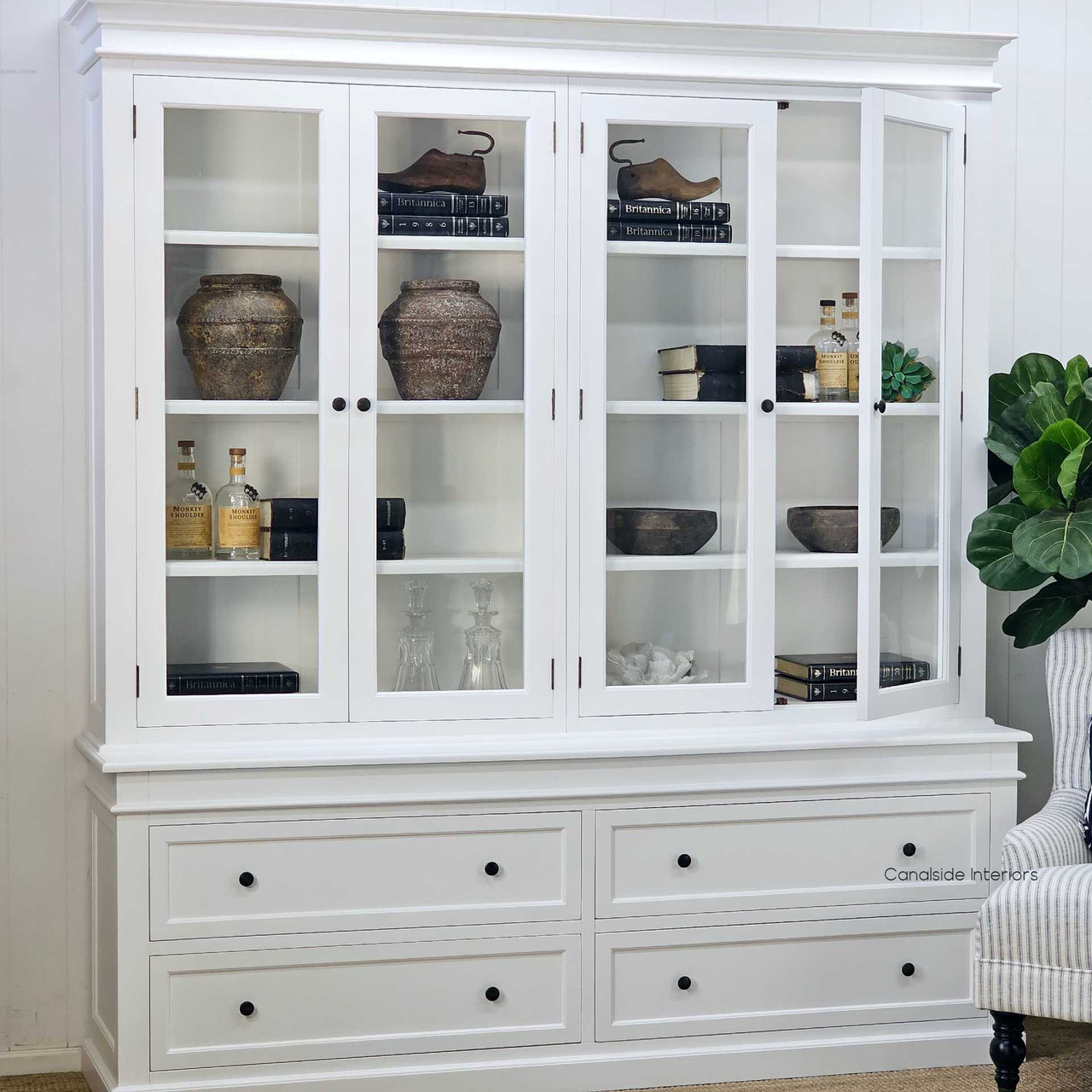 Three-quarter front-left angle showing both shelving and drawer design with hutch door ajar